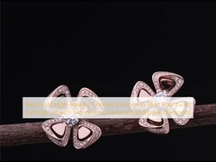 Echtgold High Jewelry Fiorever Ohrringe in 18 kt Rose Gold Ohrringe mit zwei Diamanten in der Mitte und Pavé Diamanten